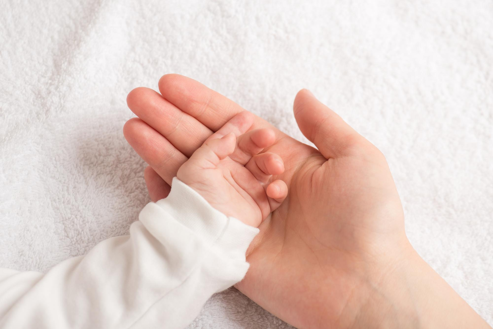 A caregiver attending to a child in a private family home